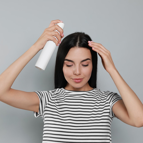 hold the bottle or can at least 6 inches away from your hair