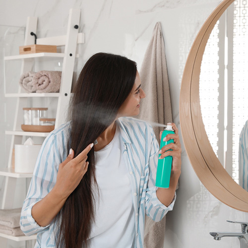 press the pump to spread the dry shampoo evenly on your hair