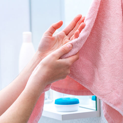 rinse your hands with water and pat dry with a clean towel.
