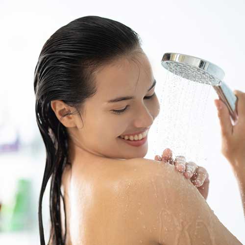 step 1 get a warm shower or bath. use a natural body scrub if required. (1)